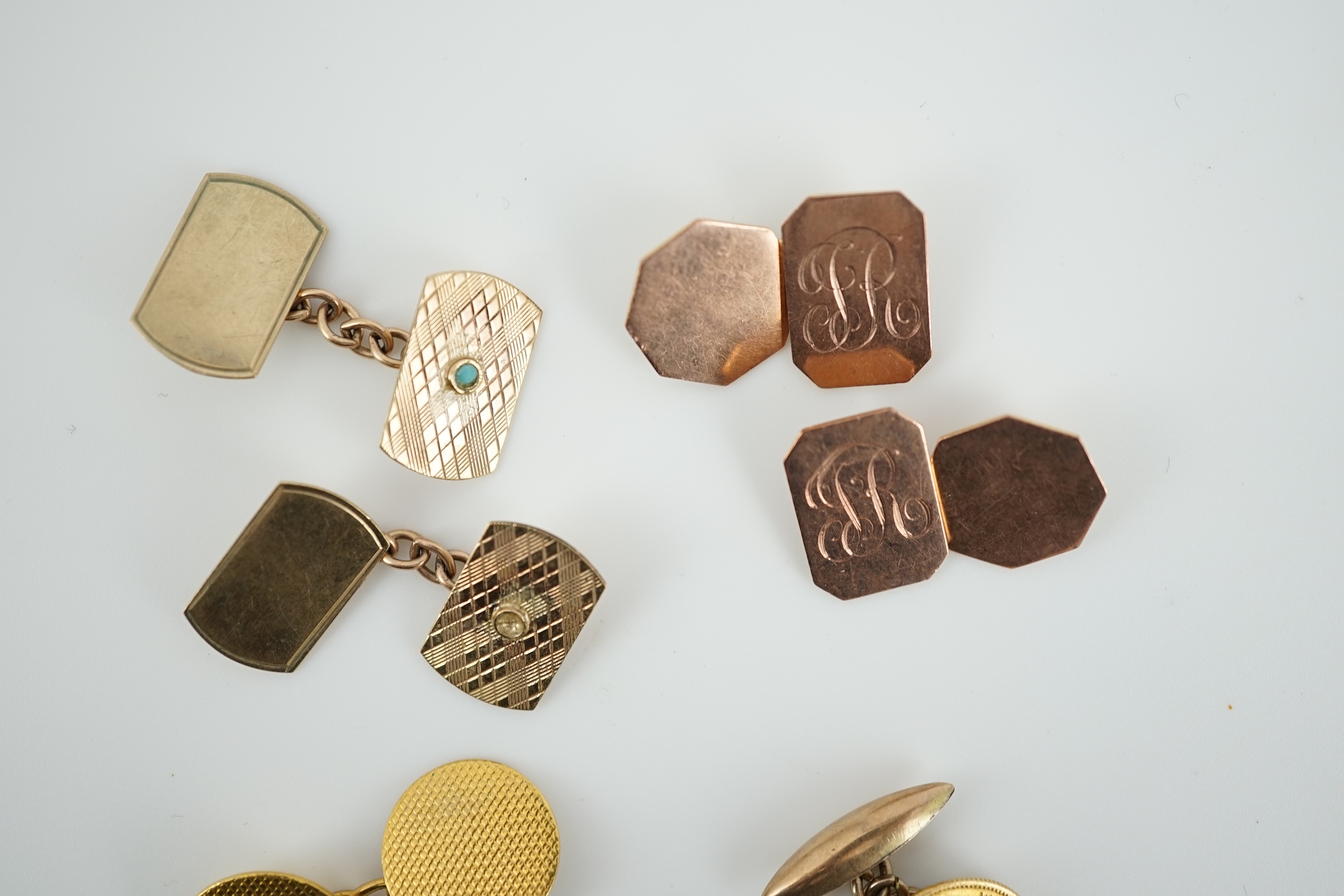 Two pairs of 9ct gold cufflinks and three single yellow metal cufflinks including coin set, gross weight 18.2 grams.